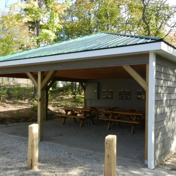 Shelter with picnic tables
